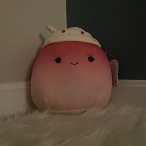 Pink smoothie squishmallow.